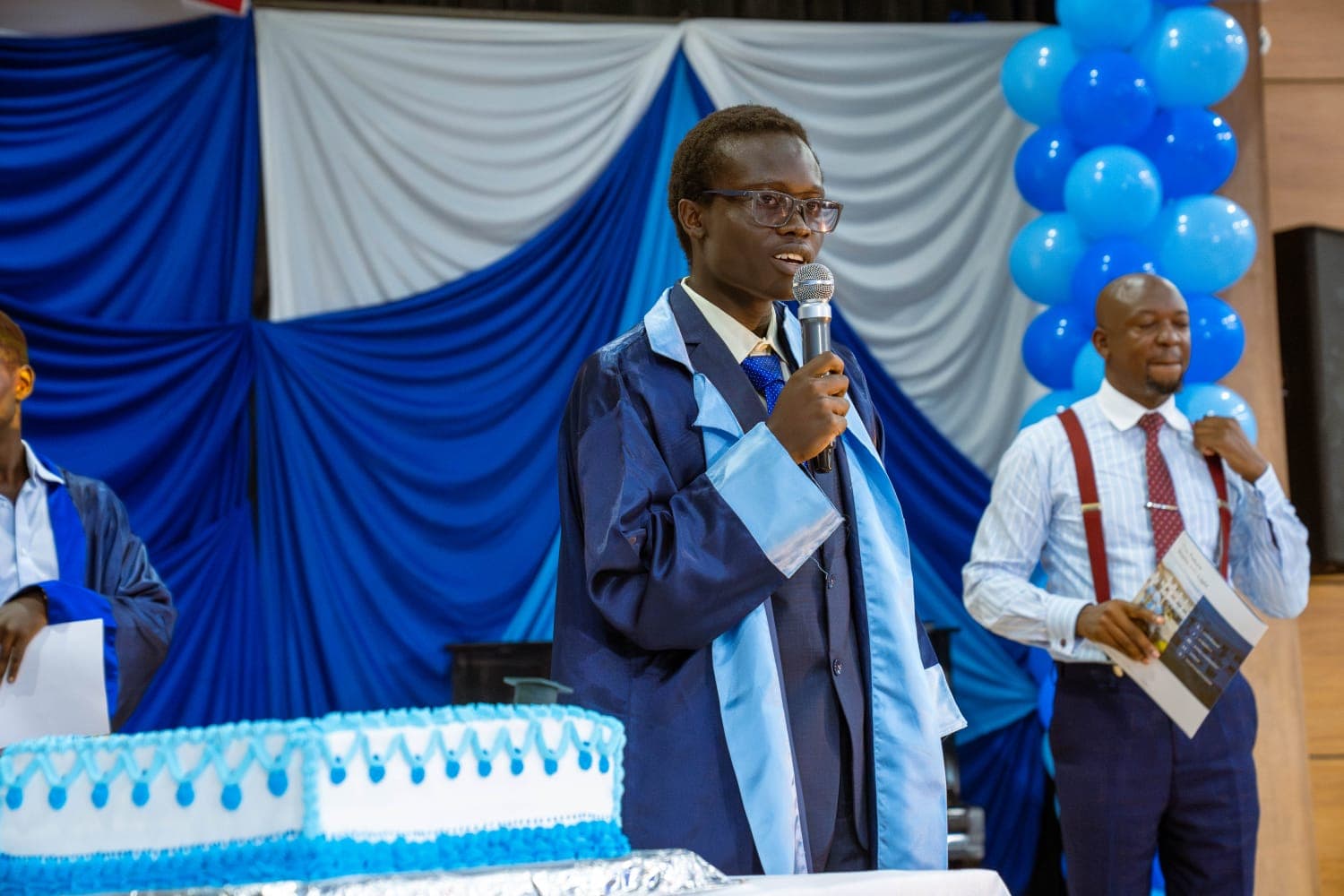 Giving the graduation speech in cap and gown